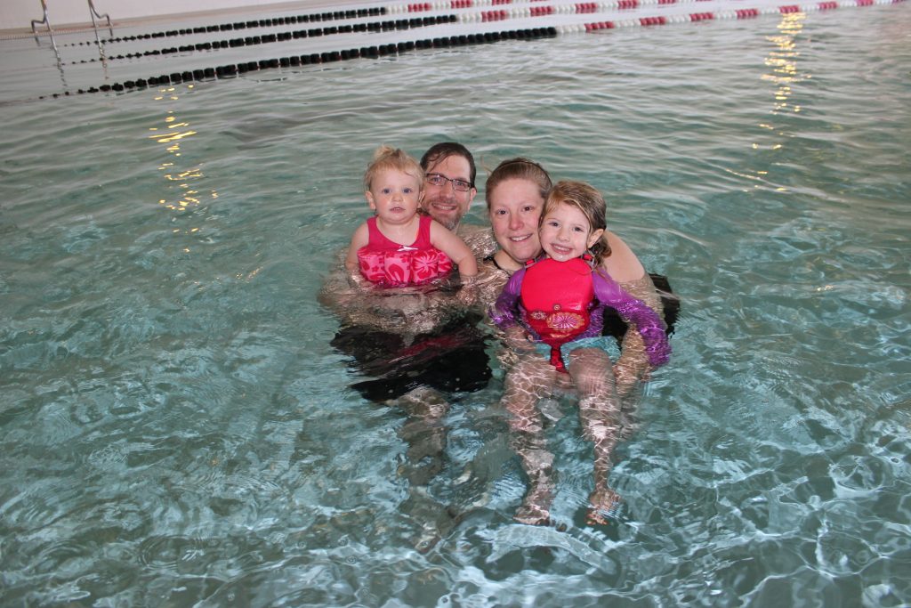 A family enjoying the swimming pool at the Recreation Center