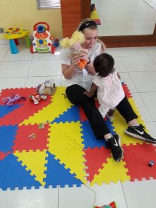 Senior nursing major Kate Vandervest interacted with a child during a site visit arranged in Panama.