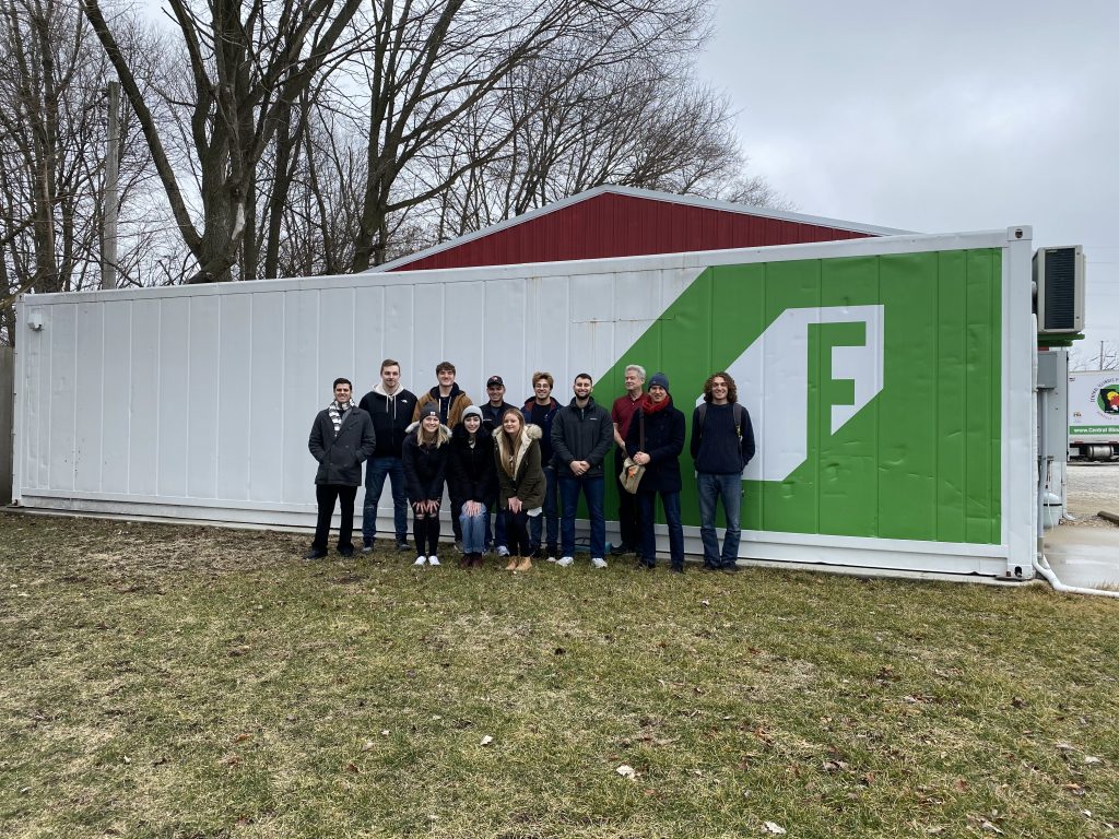 The group visiting a shipping container farm in Champaign.