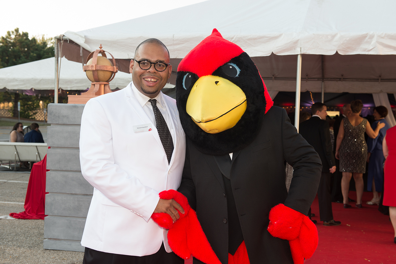 Donor Richard Greenfield poses with Reggie Redbird