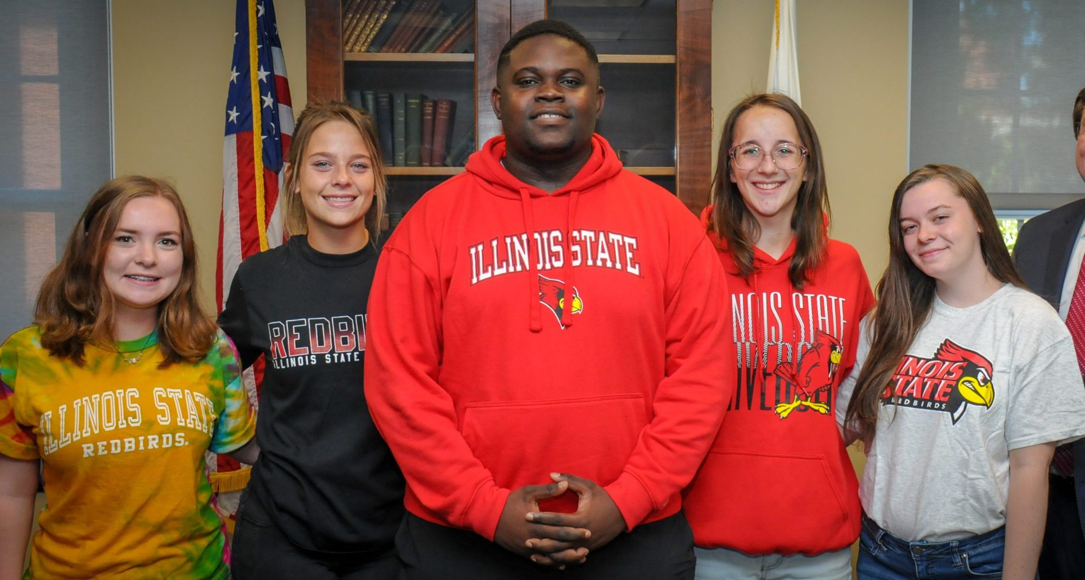 Group of five students in Illinois State University gear