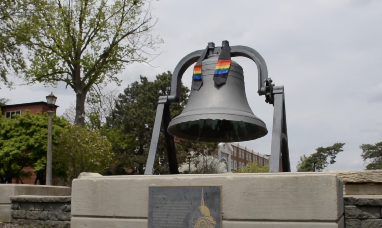 Founders Bell on Quad with LGBTQ drape on it