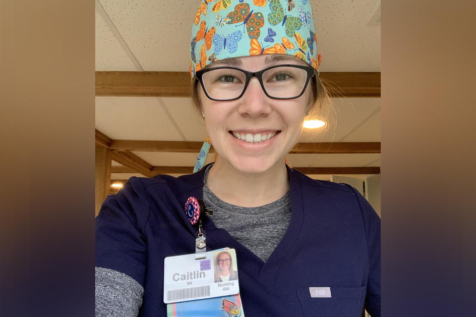 Caitlin Sims, class of 2019, in her nursing uniform