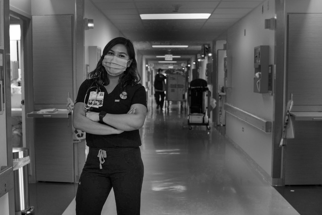Alison Alcazar, class of 2018, wearing nursing gear at her hospital