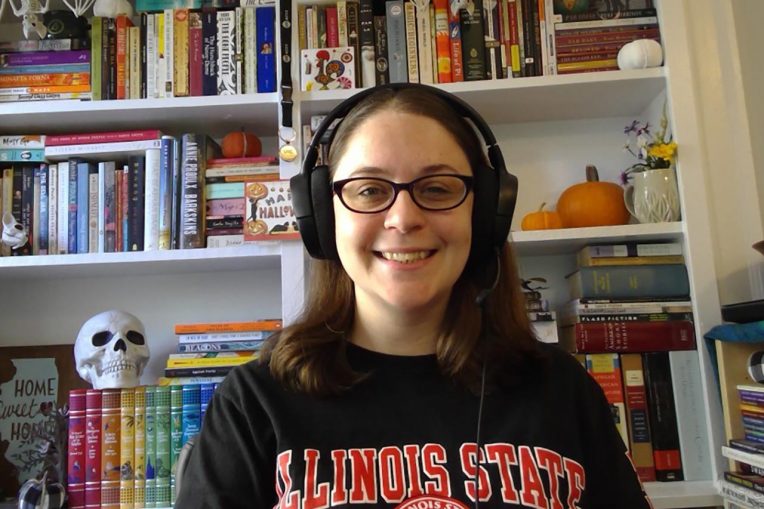 Department of English graduate student Heather O'Leary at her desk in her home office, where she teaches.