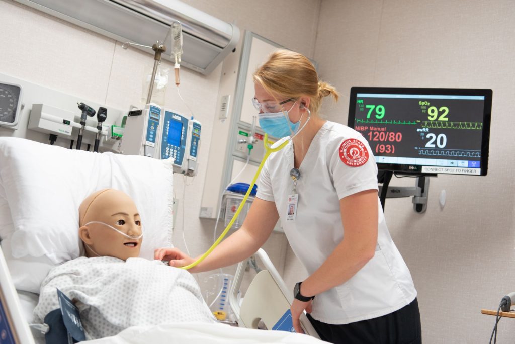 Female student works on a practice patient