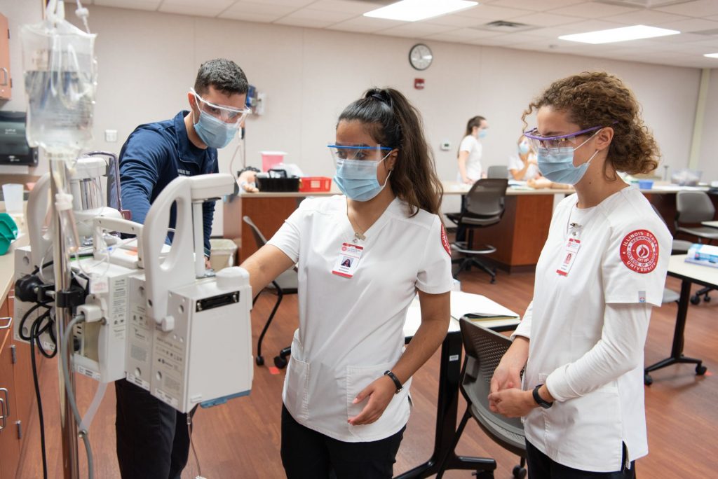Students learn how to program a patient controlled analgesia pump