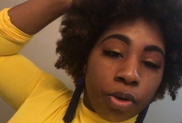 A selfie of Naudia Williams wearing a yellow shirt