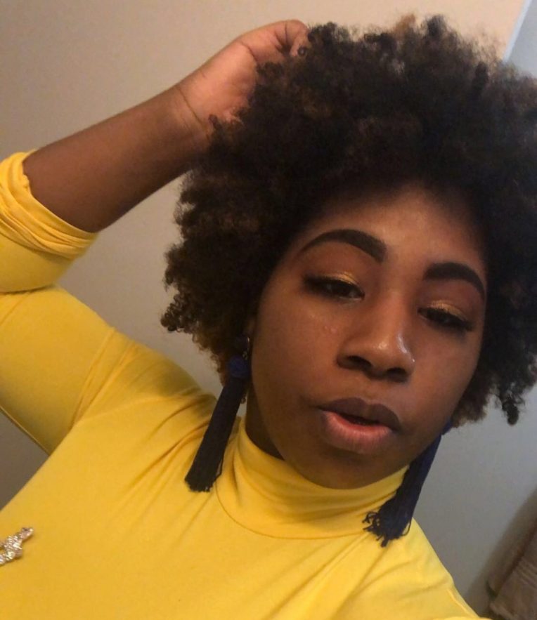 A selfie of Naudia Williams wearing a yellow shirt