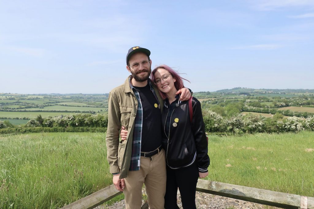 Two people smiling outside in Ireland.