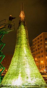 Photograph of giant glass Christmas tree being created by alum Jason Mack.