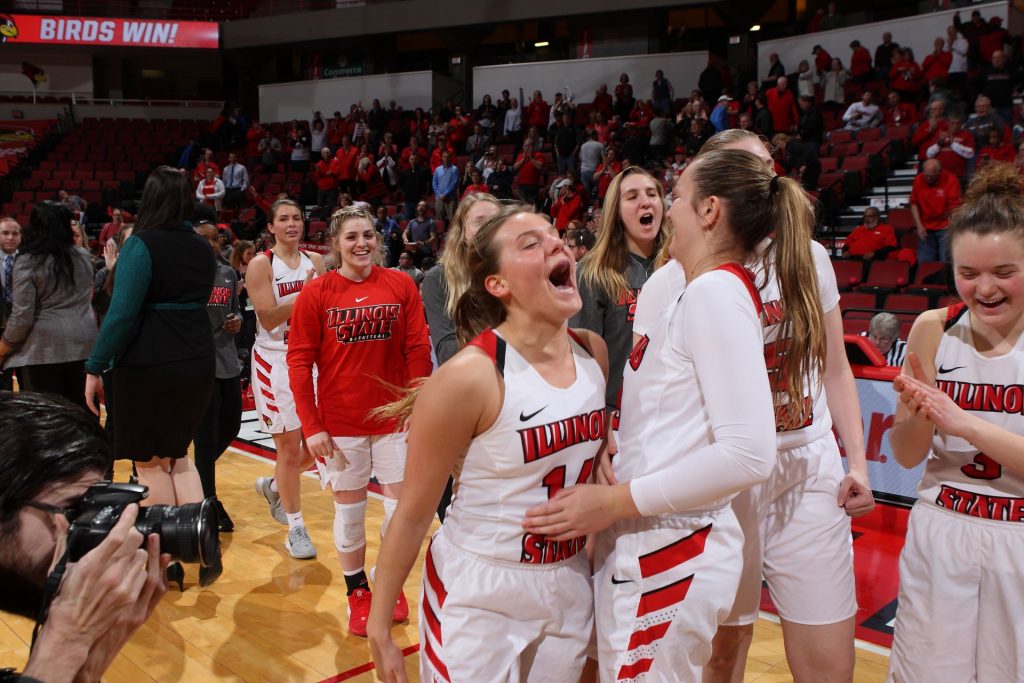 Paige Saylor celebrates with her teammates after their historic victory over Missouri State last season
