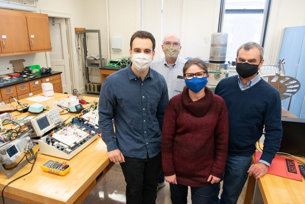 From left, Zach Mobille '19, Dr. George Rutherford, Dr. Rosangela Follmann, and Dr. Epaminondas Rosa, pictured in their laboratory.