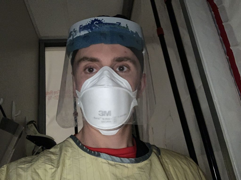 MCN faculty Harrison Krebs in PPE for an ICU shift during Winter Break.