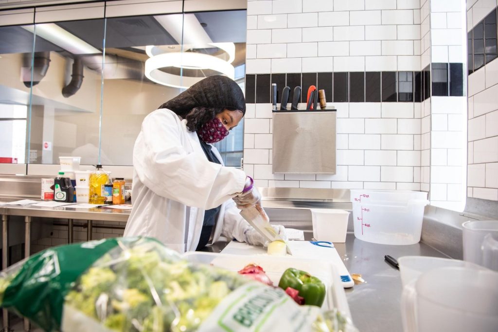 Tashaunna Divers begins her day at the test kitchen in the Culinary Support Center of Watterson Dining Commons for her professional practice internship.