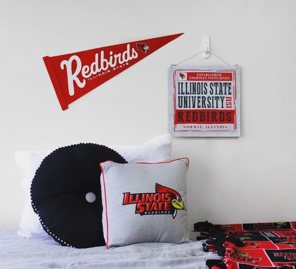 Redbird residence hall room decorated with Redbird branded accessories.