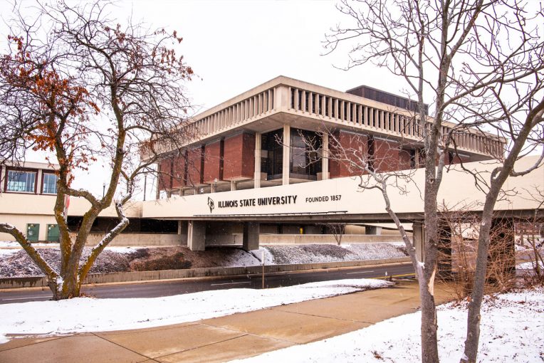 photo of the SW corner of the outsideof Milner Library with the College Avenue Bridge and trees in front