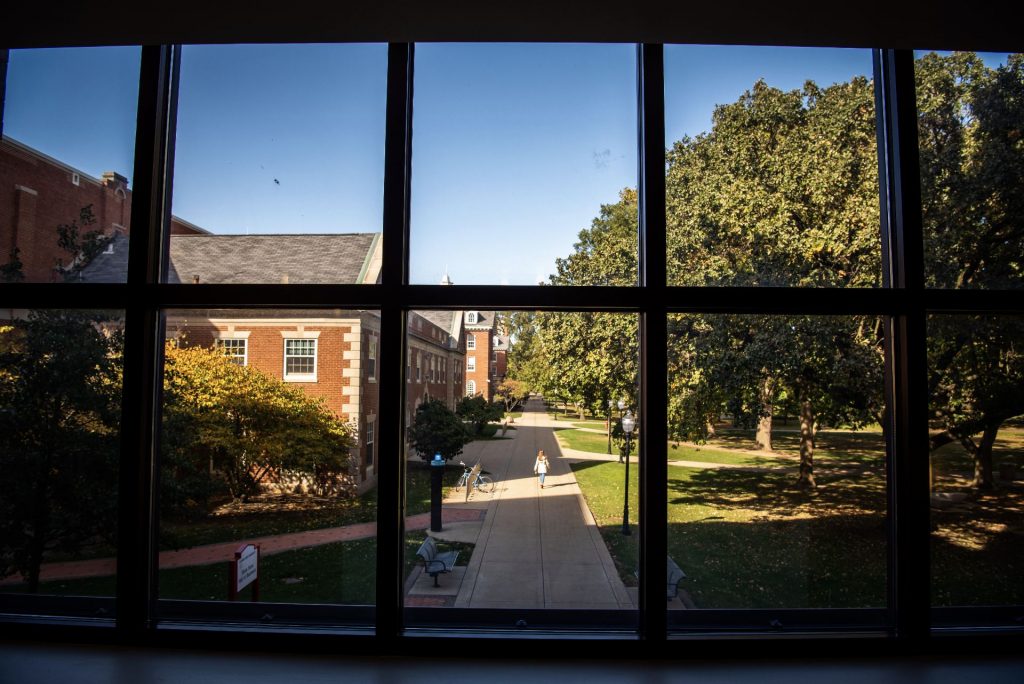 Illinois State's Quad viewed through a window in the State Farm Hall of Business