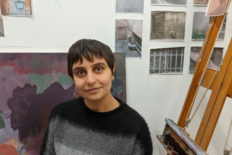 MFA Graduate Student Shahrbanoo Hamzeh in her studio. Included is some of her artwork.