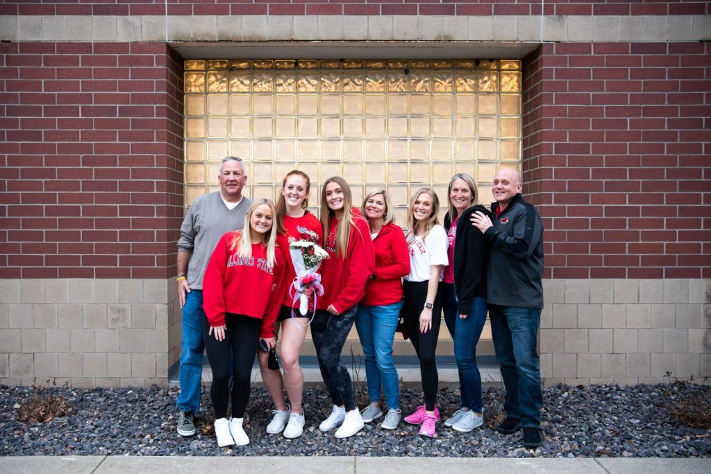Sydney Holt with her family outside of Redbird Arena.