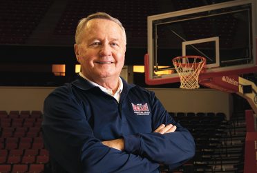 Dave Colee portrait on the Redbird basketball court