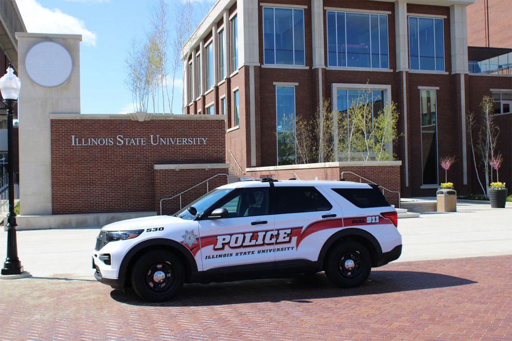 An ISU Police squad car sitting outside the Bone Student Center on a sunny afternoon