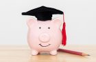 piggy bank with graduation hat and pencil