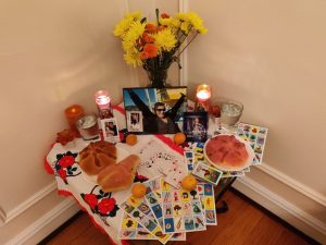 Alter with snacks, photos, candles, and cards