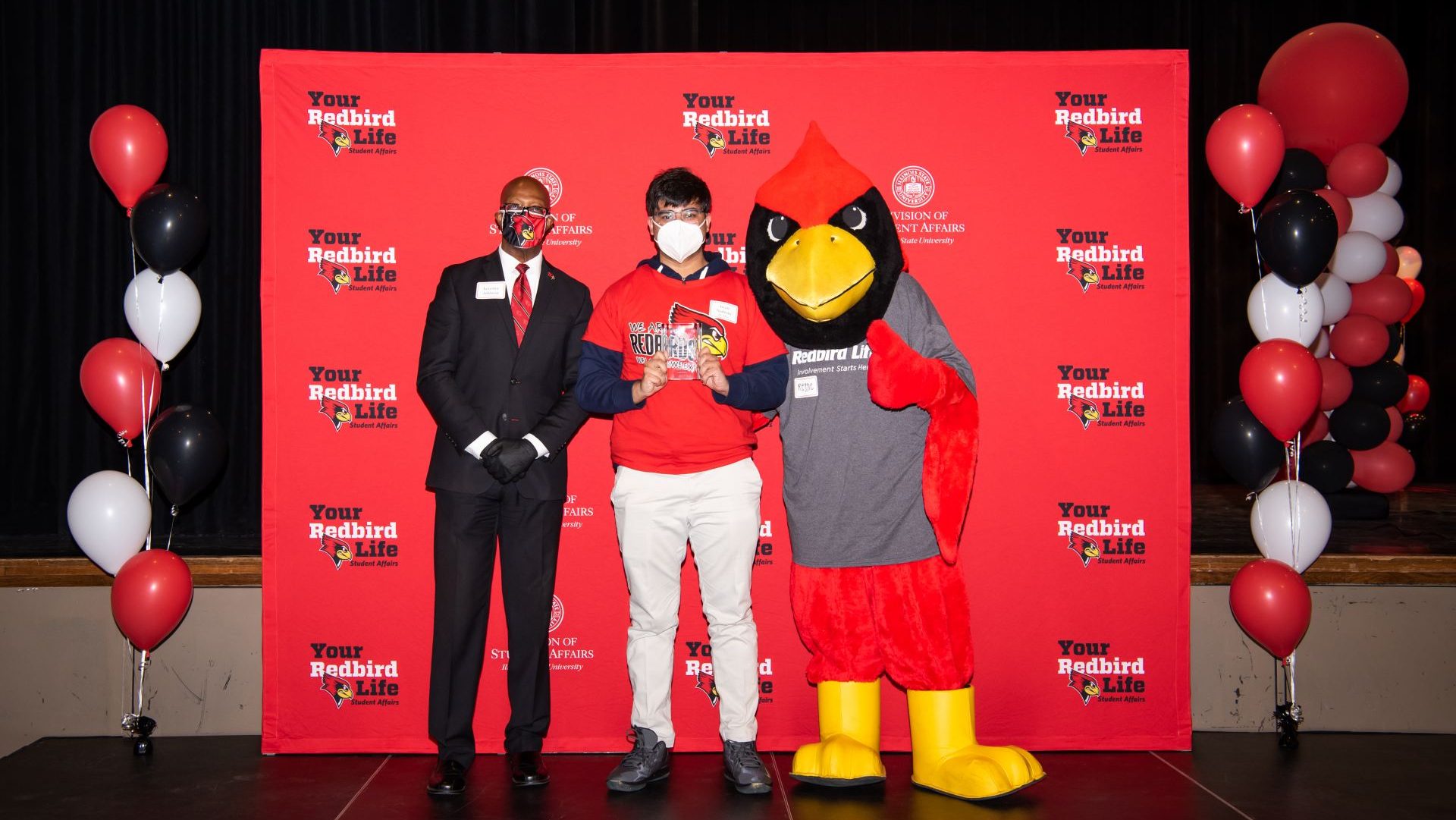 Awais Nadeem with Levester Johnson and Reggie Redbird at the Student Involvement Awards