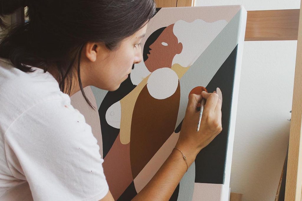 Woman painting using neutral colors