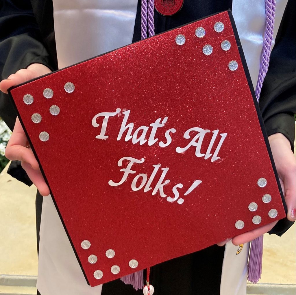 Grad cap with "That's All Folks!" on it.