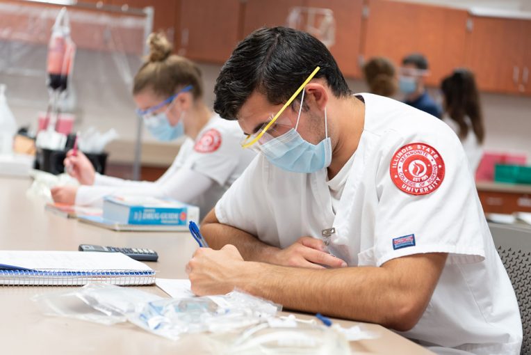 nursing students working in class