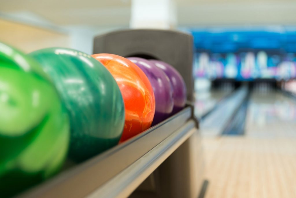 Rack Of Colorful Balls At A Bowling Alley