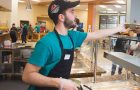 Dining Hall worker serving a customer