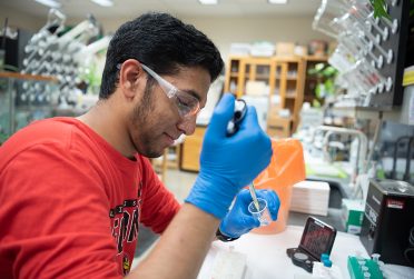 Shariq Zaman in the laboratory where he spent the summer on a research project examining the parastic disease Leishmania.