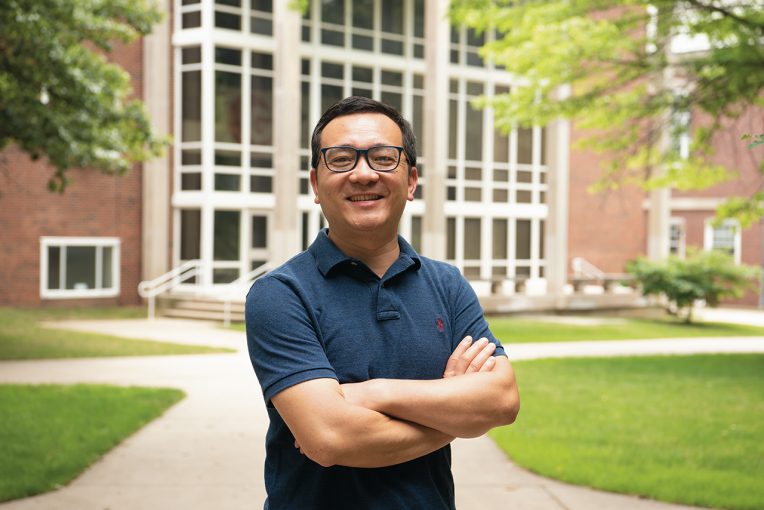Dr. Shaoen Wu in front of a university building