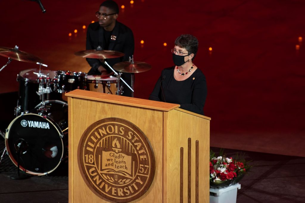 University president speaking at a podium. 