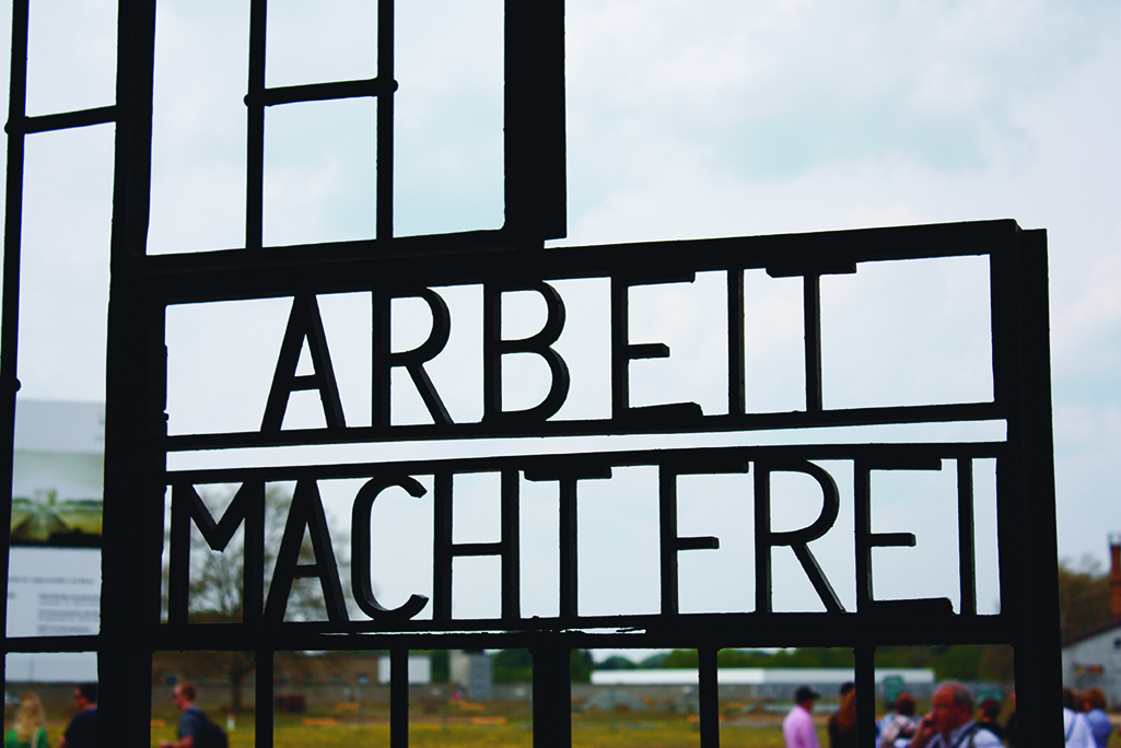 "Arbeit macht frei" German phrase, "work sets you free." A false promise that those who worked to exhaustion would eventually be released.