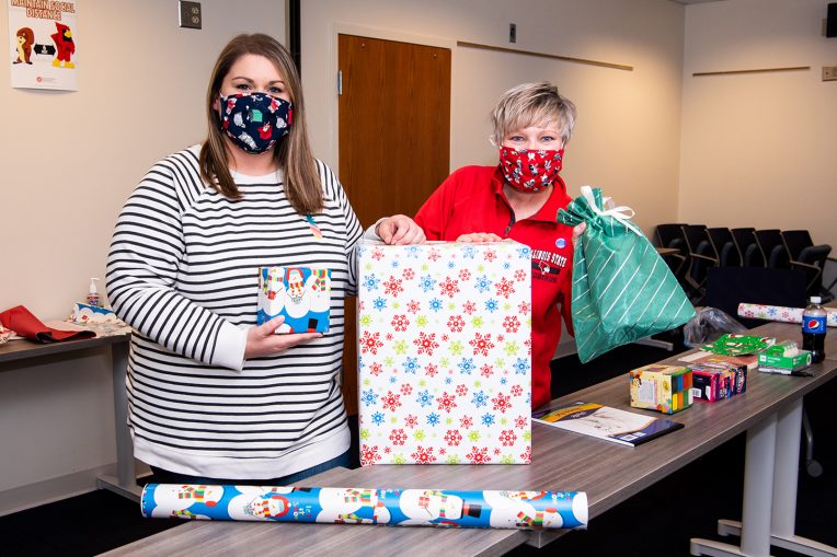 Volunteers with wrapped presents