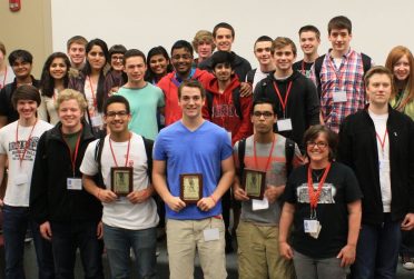 group photo of people holding plaques