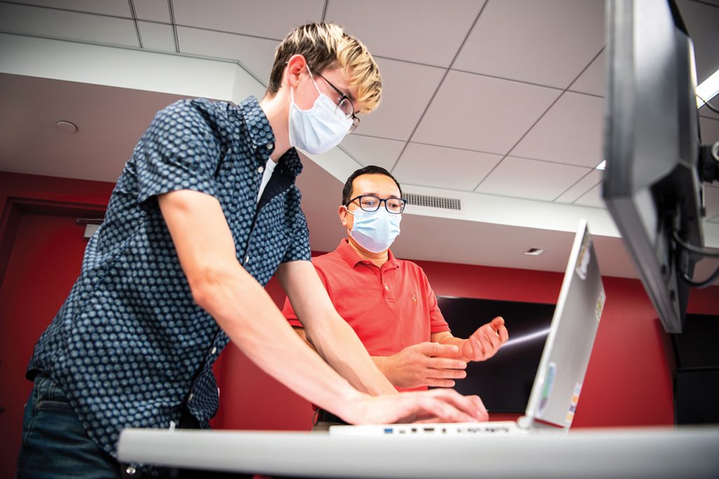 Dr. Shaoen Wu enjoys mentoring students as part of his work as the State Farm Endowed Chair of Cybersecurity. Evan Hazzard, a junior computer science major, is mentored by Wu.