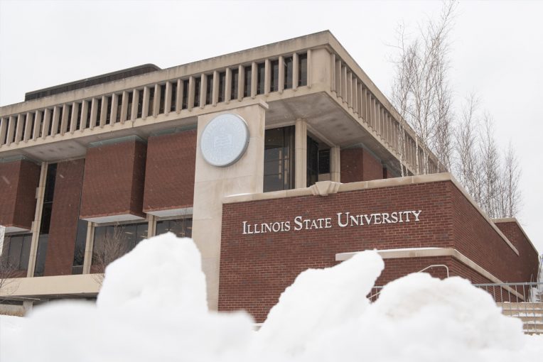 A photograph of the north side of Milner Library with the ISU seal and words Illinois State University, and snow at the bottom