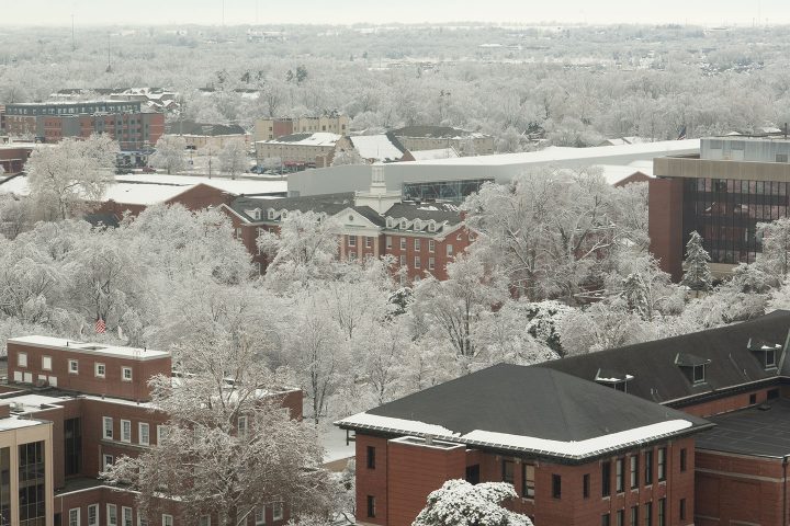 aerial shot of campus covered in snow