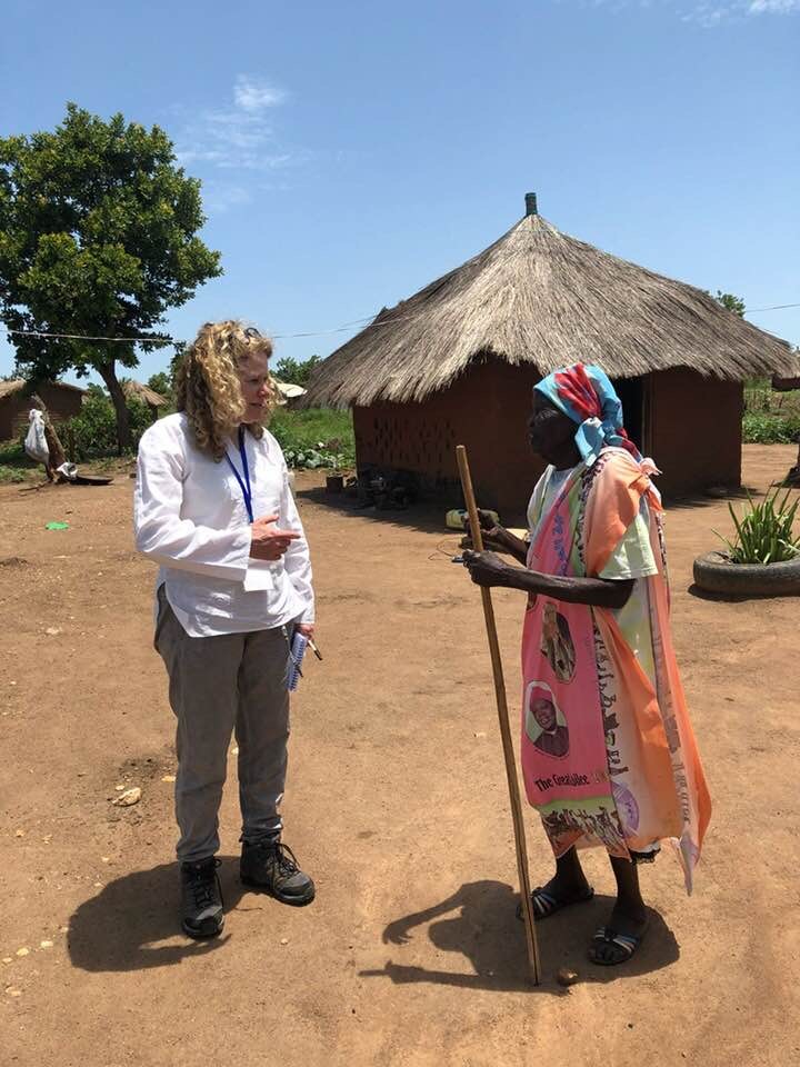 Woman talking to another woman in Uganda