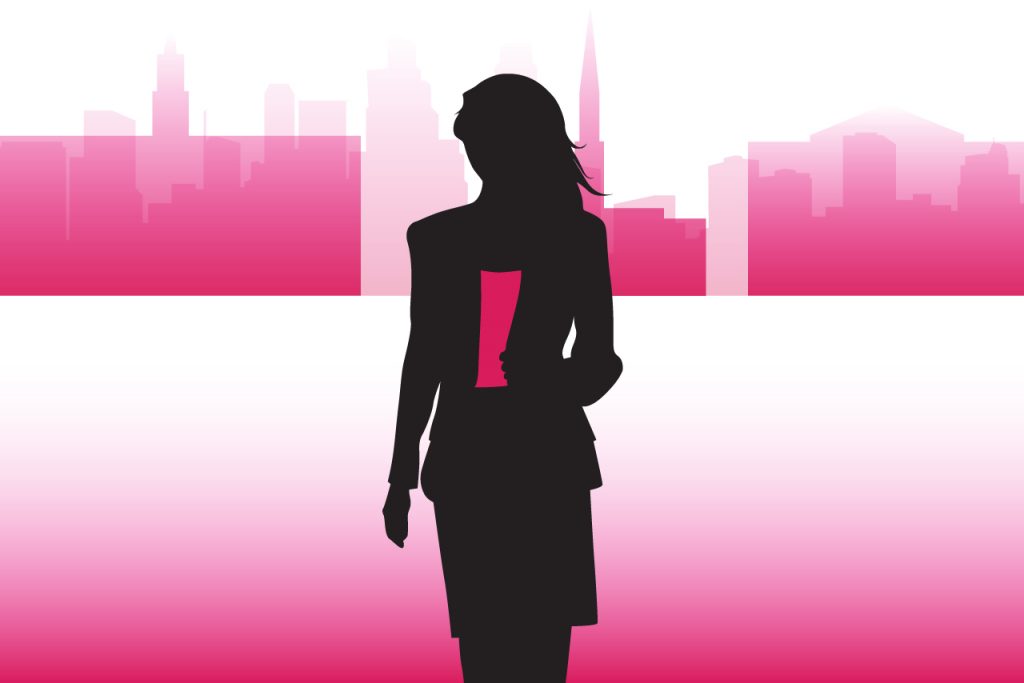 female silhouette in front of buildings