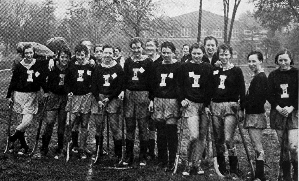Black and white photo of women wearing sports uniforms with block Is for "Illinois State Normal"