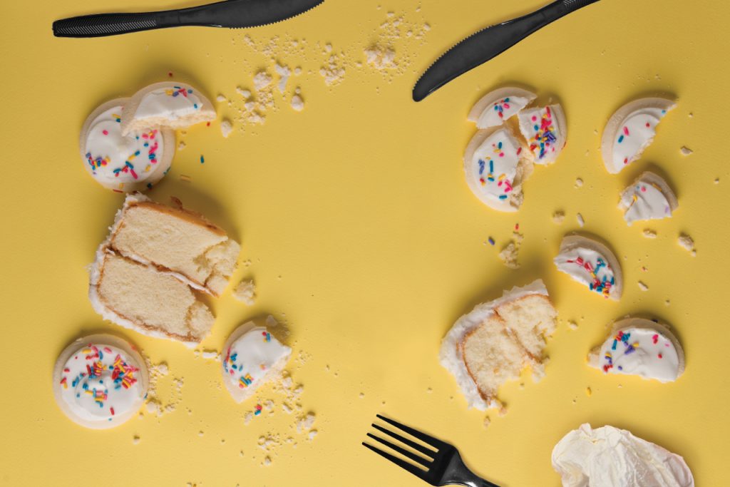 broken cake and cookie pieces on table