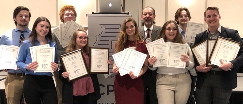 Vidette editors showcase the 26 awards the student-run media outlet received at the annual Illinois College Press Association conference on March 19 in Chicago.