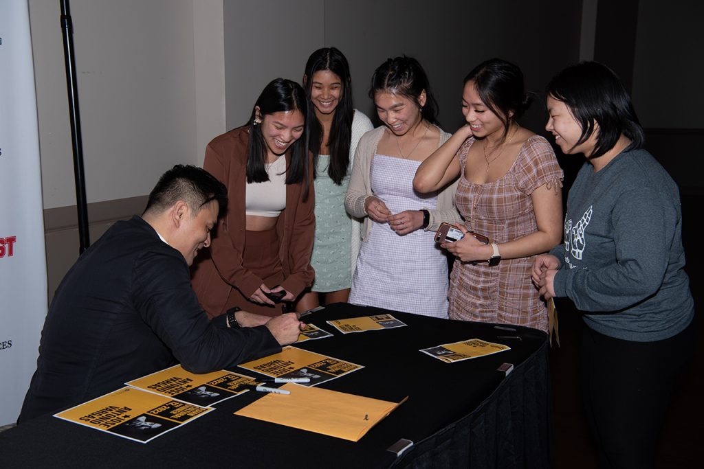 Jose Antonio Vargas signing copies of his memoir for ISU students.
