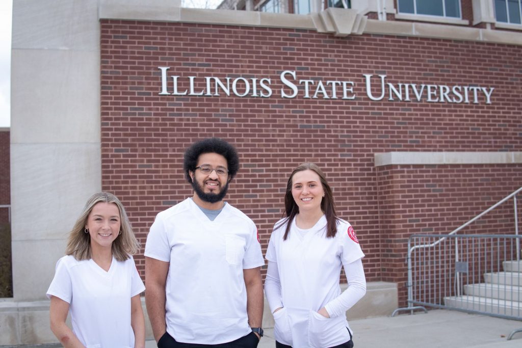 three students standing outside of the Bone Student Center